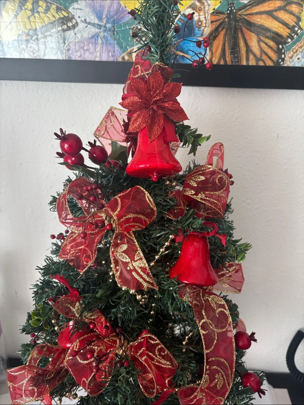 Decorative Holiday Tree with Red Ribbon and Bells
